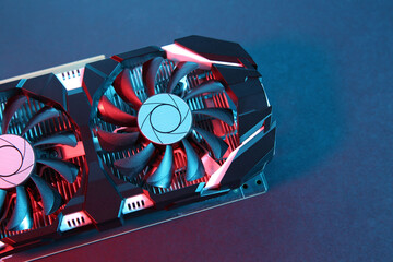 Computer graphics card on color background, top view. Space for text