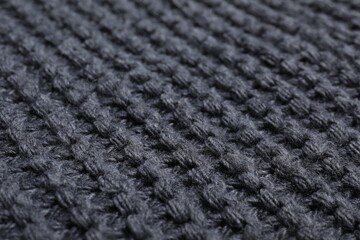 Gray knitted scarf as background, closeup view