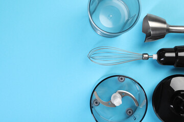 Hand blender kit on light blue background, flat lay. Space for text