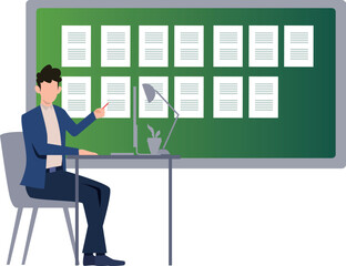 The boy is reading at his desk.