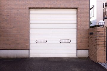 A closeup shot of automatic metal roller door used in factory, storage, garage, and industrial...