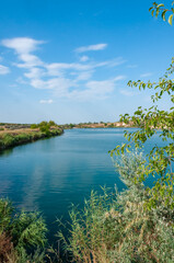 View of the flooded granite quarry with turquoise clear water, Ukraine