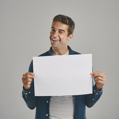 Man, portrait and poster mockup in studio or announcement placard for advertising space, promotion...