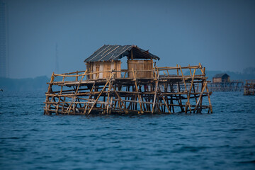 a floating bamboo fishermen's settlement over Jakarta Bay Indonesia, thousands islands or kepulauan seribu