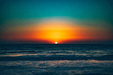 A colorful sunset over Rockaway Beach in Pacifica, California