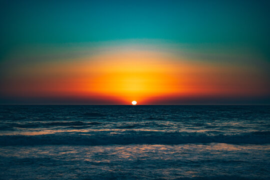 A colorful sunset over Rockaway Beach in Pacifica, California