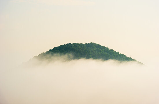A mountainside peeking through morning fog near Helen, Georgia