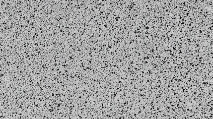 Obraz premium A grey and black patterned surface with many small dots. The surface is very smooth and has a very clean look