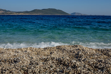 Beautiful coast stony beach at summer . Greece.