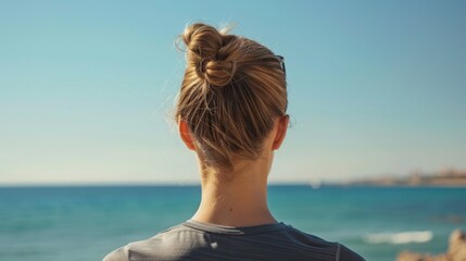 Obraz premium Beach or sports, fitness A woman with neck pain after exercise, body training, or outdoor workout. Red light, rear view or injured girl runner with muscle tendon after jogging.