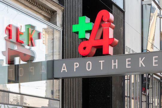 Pharmacy sign and logo in Vienna, the letter A with a green cross and the word APOTHEKE; Austria, Vienna, January 29, 2024, 