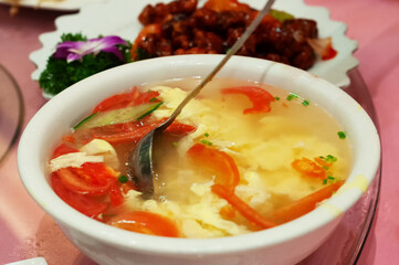 Close up of tomato egg drop soup