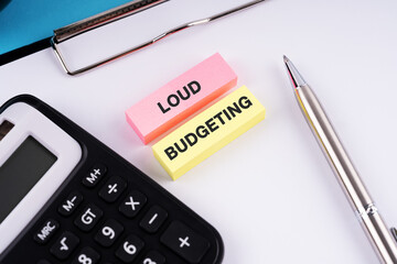 Loud budgeting text on clipboard business and financial concept