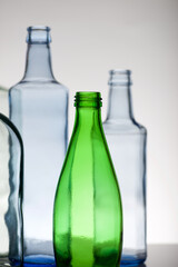 Empty glass water bottles on a table