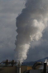 Air pollution emissions from smokestacks.