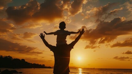 Silhouette of a parent carrying a child on shoulders during a beautiful sunset by the beach, symbolizing joy and family bonding.