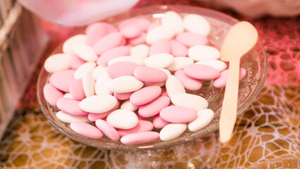 Plate of white and pink confetti for wedding or baptism