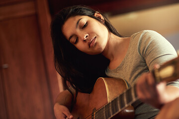 Guitar, artist and woman musician on bed learning song for performance, recital or concert. Musical...