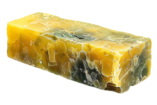 Close-up of a colorful handmade soap bar with multiple shades of yellow and green, showcasing its organic and natural texture.