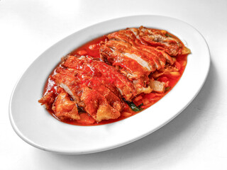 Chicken baked with onion in tomatoes with white cabbage salad.