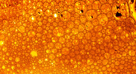 Yellow drink bubble texture close-up,Beer Background Ice Cold Pint With Water Drops...