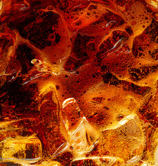 Macro cola background and bubbles,Cola with Ice. Food background