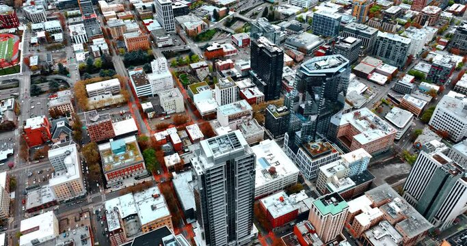 Districts and streets of Portland from drone footage. Older and newer architecture of metropolis from top view.