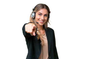 Telemarketer pretty Uruguayan woman working with a headset over isolated background points finger at you with a confident expression