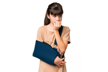 Little caucasian girl with broken arm and wearing a sling over isolated background having doubts