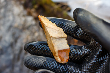 Pointed flint tool with retouched edge, Stone Age tool found on the shore, Russia