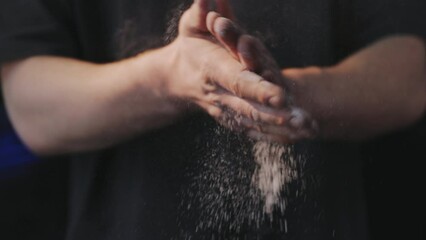 fitness man athlete hands clapping chalk powder sportsman preparing training workout in gym ready for bodybuilding strength exercise slow motion close up