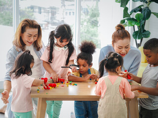 Extended multiethnic family playing together at home. New Year, holiday, family time together