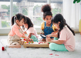 Extended multiethnic family playing together at home. New Year, holiday, family time together