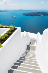 White architecture in Santorini island, Greece. Stairs to the sea.