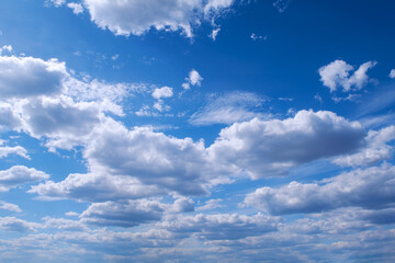 White cumulus clouds in blue sky beautiful cloud background.