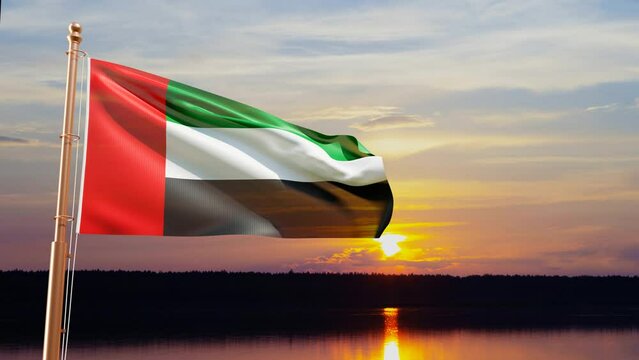 Flag of United Arab Emirates waving in the wind against the sunset
