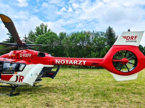 Kiel, Germany - 24.May 2024: View of a stationary red helicopter of the German Air Rescue DRF.
