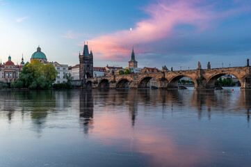 Colorful sunrise over Charles Bridge (Karluv Most) over Vltava River in Prague, Czech Republic