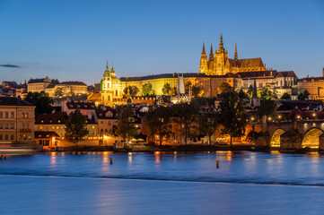 Charles bridge (Karlův most) and Hradcany castle hill over Vltava in the night, Prague, Czech Republic