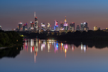 Night panorama of Warsaw downtown skyline, Poland, over Vistula river