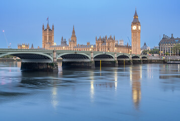 Early morning with Palace of Westminster and Big Ben clock tower seen across River Thames, London, United Kingdom