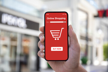 Man hand hold phone with online shopping application on screen