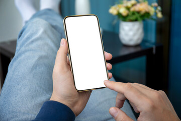 male hands hold phone with isolated screen background of jeans