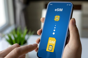 Man hand hold phone with Sim card replacement on eSim