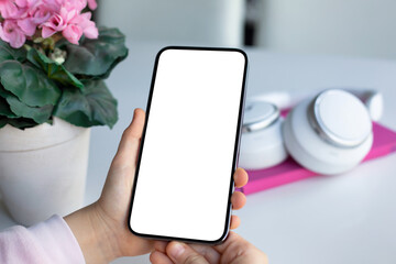 children hands hold phone with isolated screen background of headphones