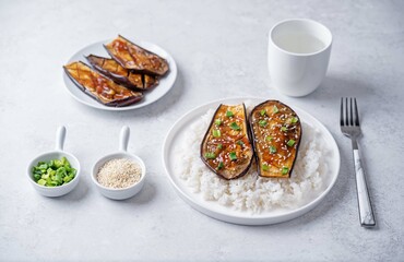 Teriyaki sauce eggplant slices with rice in a plate