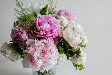 Beautiful pink flowers bouquet background. Blooming peony close-up with water drops, morning dew. Wedding backdrop, Valentine's Day concept. Blossom, flower