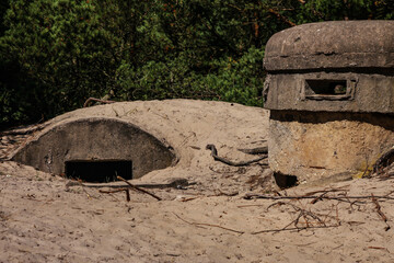 Old fortifications of the Polish coast. A sniper position buried in the sand.  Hel, Hel peninsula, Pomerania, Poland, Europe
