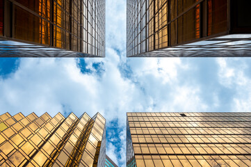 HONG KONG, CHINA - January, 2021 : Golden tall buildings and glass reflections in Hong Kong Island Business concepts of buildings and architecture