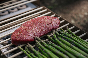  steak and asparagus preparing on grill. Summer leisure